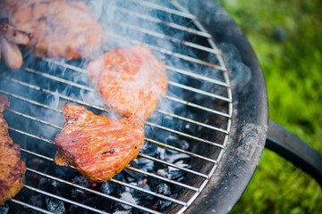 Close up view on meat on bbq hot grid grilling