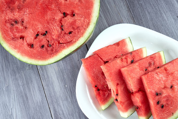 Chopped pieces of watermelon on a white plate