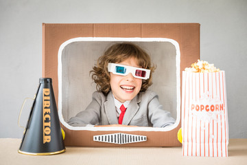 Child playing with cartoon TV