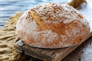 Whole homemade bread with sunflower seeds.