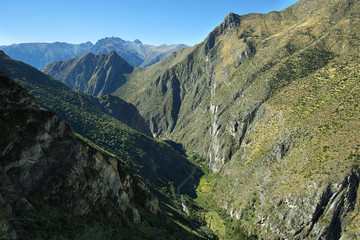 Sheer mountains in the way to ancient village of Huaquis, Peru