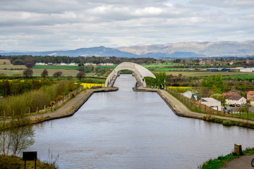 A view of Falkirk Wheel aqueduct and background hills - obrazy, fototapety, plakaty