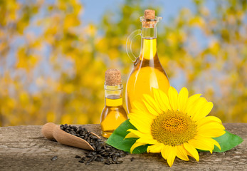 Sunflower oil and flower isolated on white background