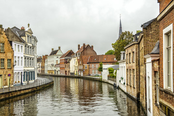 Fototapeta na wymiar Beautiful Peaceful Canals in European City of Bruge