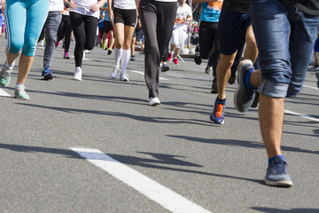 Marathon running race, people feet on road, sport, fitness and healthy lifestyle concept