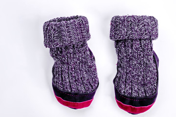 Kids two woolen knitted socks. Cute childrens warm knitted socks isolated on white background.