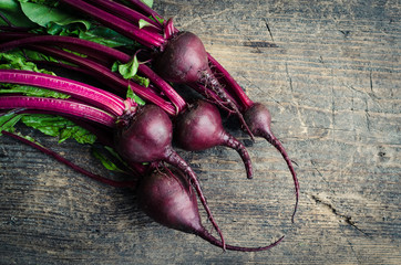 Young beets on wooden table