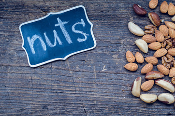 Nuts mix on wooden background