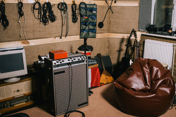 Old-fashioned recording studio with instruments. Hobby for hipsters in garage. Album making...