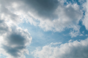 Fototapeta na wymiar White clouds against the blue sky