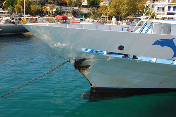 Obraz premium Skiathos town on Skiathos Island, Greece. Beautiful view of the old town with boats in the harbor.