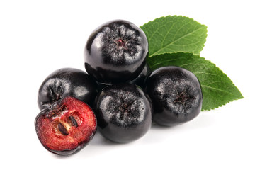 Chokeberry with leaf isolated on white background. Black aronia berries