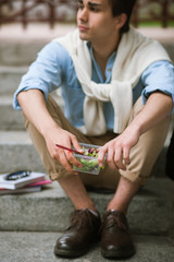 Healthy food diet outdoors. Thoughtful male. Lunch break with salad, stylish young man, nutrition concept