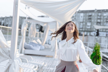 fashion portrait of happy beautiful girl in white shirt and casual dress