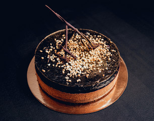 Chocolate cake on dark background.