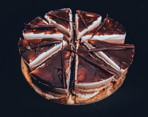 Chocolate cake on dark background.