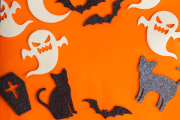 Halloween flat lay scene on orange background with copy space