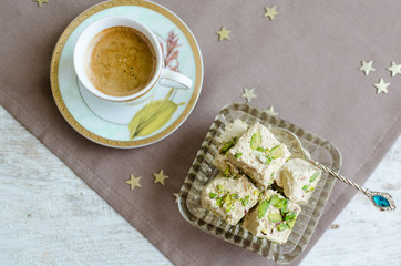 Halva pistachio and cup of coffee