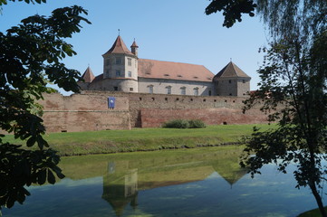 Fototapeta premium Picture with Fagaras fortress (1310), Brasov, Romania