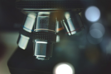 Plakat Laboratory Equipment - Optical Microscope. Microscope is used for conducting planned, research experiments, educational demonstrations in medical and health institutions, laboratories. Close up photo.