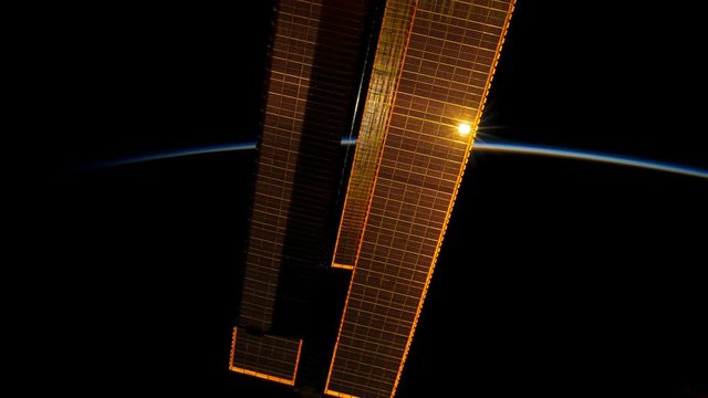 International Space Station (ISS) view of cloudy rotating planet earth with sunrise. Created from Public Domain images, courtesy of NASA Johnson Space Center : http://eol.jsc.nasa.gov. 