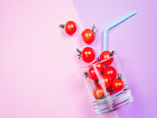 Naklejka na ściany i meble Tomato juice or smoothie, cherry tomato in drink glass with straw