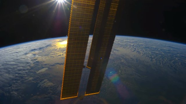 International Space Station (ISS) view of cloudy rotating planet earth with sunset. Created from Public Domain images, courtesy of NASA Johnson Space Center : http://eol.jsc.nasa.gov. 