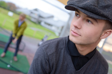 young golfer practicing