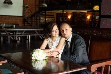 likable and pretty wedding couple at home enjoy the wonderful moments in the wedding day