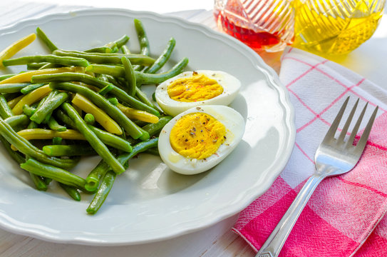 Cooked green beans with boiled eggs
