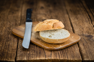 Wooden table with German Rolls, selective focus - obrazy, fototapety, plakaty