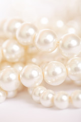 Pile of pearls on the white background
