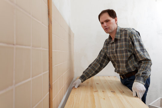 Worker installing a countertop