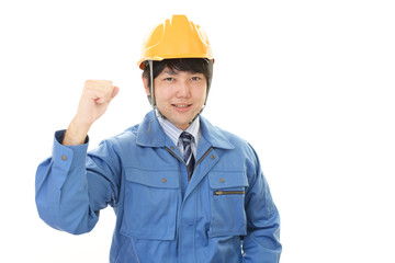 ガッツポーズの労働者