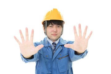 ストップのジェスチャーをする労働者