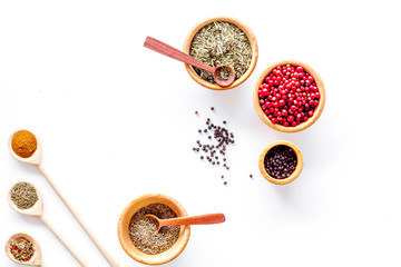 Spicy food cooking with spices and dry herbs white kitchen desk background top view mock up