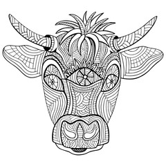 Hand-drawn head of cow. Zentangle and doodle style. Coloring book or tattoo. Vector illustration.