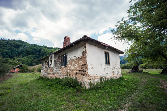 abandoned old house in rural mountain landscape