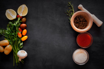 Mediterranean food - vegetables and sauces on the chalkboard. Top view