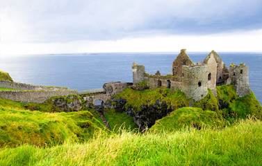 Dunluce castle in Northern Ireland, United Kingdom. Causeway coastal driving route on the Emerald Island.
