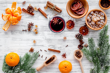 Ingredients mulled wine or grog with spices and citrus for winter evening. Christmas new year eve. Wooden background top view.