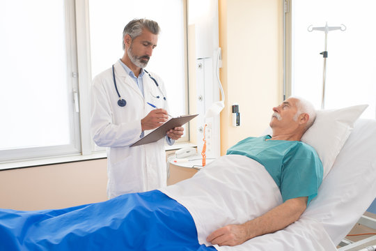 doctor talking to patient in hospital