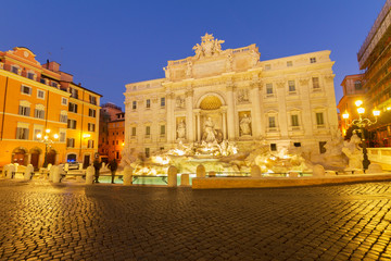 Fototapeta na wymiar view of famous restored Fountain di Trevi in Rome illuminated at night, Italy