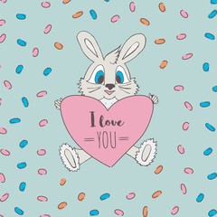 Cute little bunny with a heart with the words I love you.