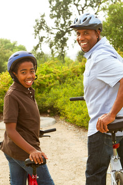 Father and son riding bikes.