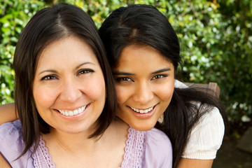 Hispanic mother and daughter.