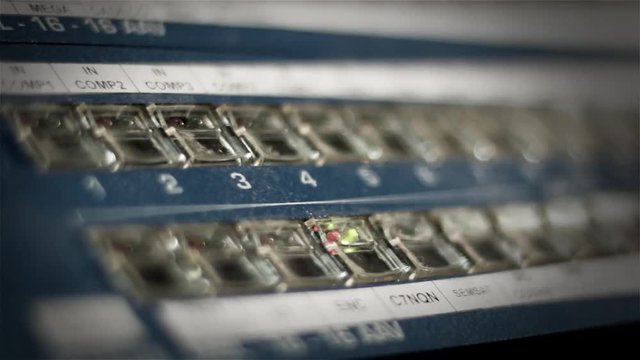 Hand pressing buttons in console