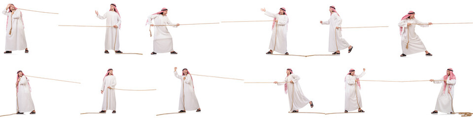 Arab in tug of war concept on white