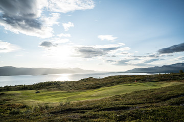 Fototapeta na wymiar Golf course at The Tornetrask Lake Area