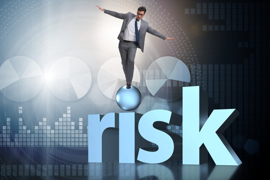 Young businessman in business risk and uncertainty concept